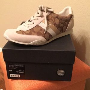 Women’s Coach sneakers.